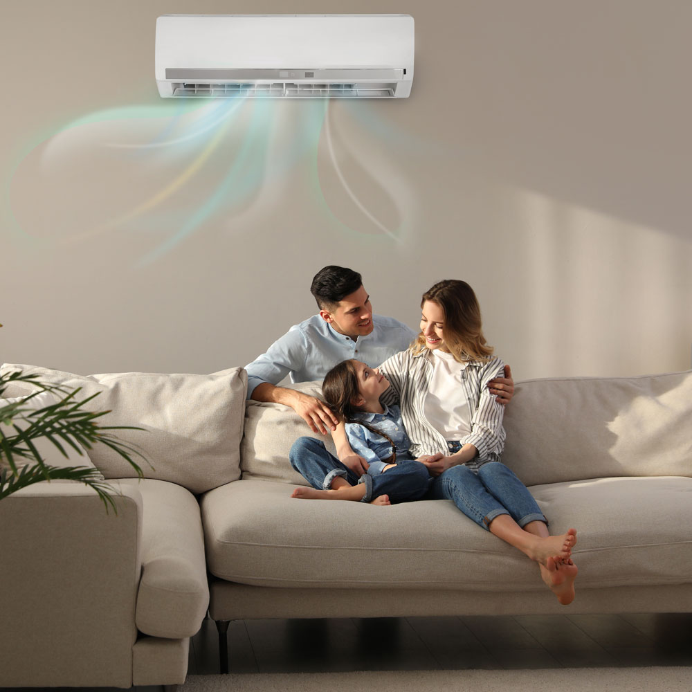 Family in living room under air conditioner Townsville